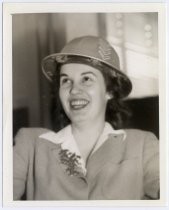 Barbara Ferrin modeling years-of-service hat