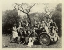 Group portrait around automobile