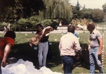 Shoveling Snow at the Happy Hollow Snowman Building Contest