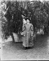 Woman in cap and gown, c. 1912