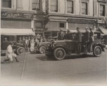 Woman pulling a car with a rope in her mouth