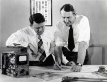 William Hewlett and David Packard with precise measuring instrument