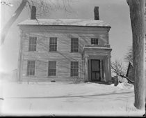 Two-story colonial house in winter, c. 1912