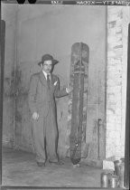 Unidentified man in suit with aerial bomb