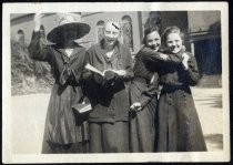 Four young women in school uniform outside school