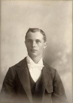 Young man with white tie and dark suit