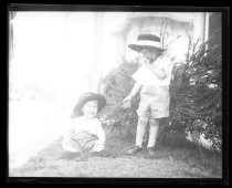 Two young children in shorts and Fiesta hats