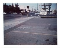 Spartan Drive-In sign behind Southern Lumber sign