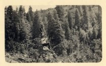 Harold Elliott and unidentified man on mountain rock