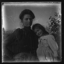 Young woman posing with younger girl