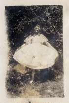 Person in white ruffled dress