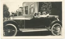 Helen Bernice and Howard Walter Campin seated in auto at South 14th Street, San Jose, CA