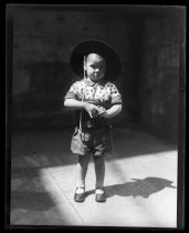 Portrait of young boy in shorts, wearing hat for Fiesta