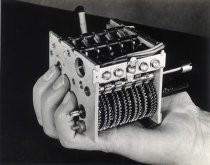 Mechanism for Galvin Manufacturing/Motorola clock-radio in man's hand