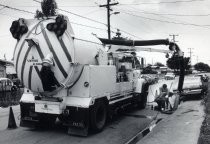 Power-Vactor cleaning a storm drain