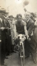 Bike racer with crowd at start