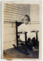 One of the Stumble children, in rocking chair