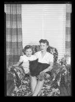 Portrait of mother and daughter with dog, c. 1940