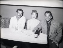 Ramon Torres with man and woman at Ringside Bar table