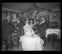 Group portrait in dining room decorated for party