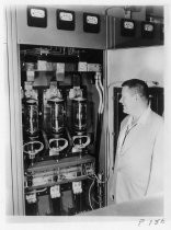 Jo Jennings inspecting installation of vacuum switches, c.1957