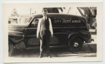 L. D. Bohnett, Jr., standing next to "City Parcel Service" vehicle