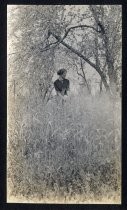 Woman posing in tall grass, Winchester estate