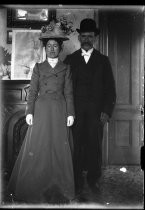 Couple posing in formal clothing, c. 1906