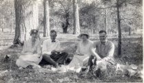 Harold Elliott at picnic in forest with group