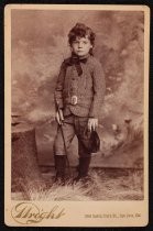 Studio portrait of child in riding suit