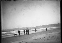 Six men on the beach with dog, c. 1906