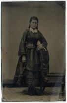 Portrait of young woman with braids and earrings