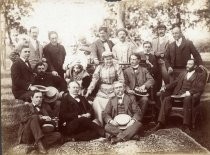 Group of Men and Women Seated Outdoors