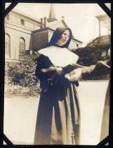Nun, holding a book