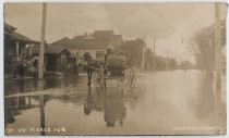 Horse-drawn carriage on flooded Pierce Avenue, 1911