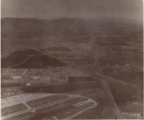 Aerial view of airport runways looking towards mountains