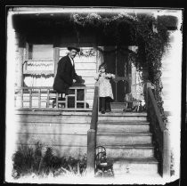 Man and young girl on porch