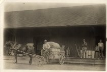 Jade Beall in front of Tony Anderson's Feed and Fuel Company, Mayfield