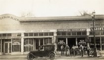 Men on bikes outside Maxwell's Cyclery