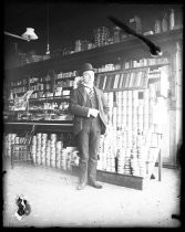 Man standing inside pharmacy interior