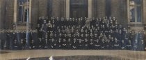 Group portrait outside brick building