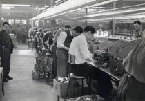 Male assembly line workers, Motorola factory