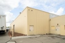 Oblique view of south portion of Sunlite Baking Co. building primary facade