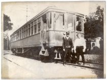 Victor Schadt and Jim Roy in front of streetcar, 1925