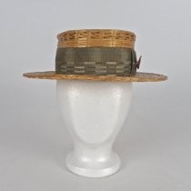 Straw boater with green ribbon hatband