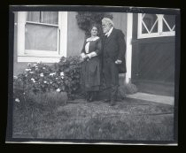 Edwin Markham and woman in yard