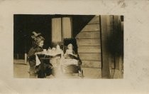 Young girl having tea party with doll