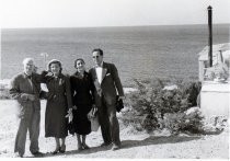 Lee and Marie de Forest on the beach with a younger couple