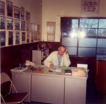 Harry Slonaker at his desk at Boys City