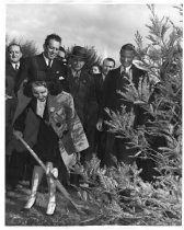 Padilla and Renzel planting a tree in Rose Garden